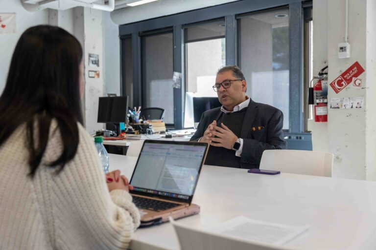 Naheed Nenshi is interviewed by journalists at the University of Calgary Gauntlet newspaper